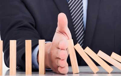 businessman hand stop dominoes continuous toppled
